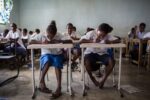Grade 7 students complete classwork; Photo by DFAT photo library