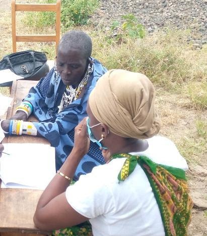 Ua Kassim meeting with an Engorika Village community member. Photo credit: Enata Mutayoba, RTI