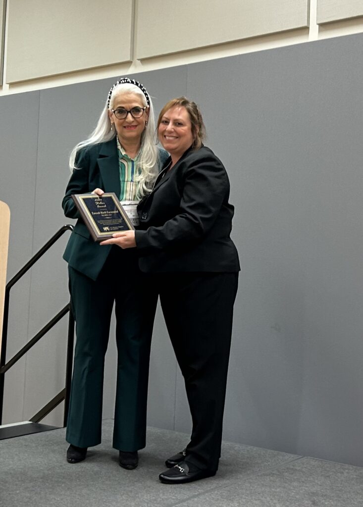Dr. Taroub Harb Faramand, founder and president of WI-HER LLC, received the 2024 USWCC Stellar Award from the U.S. Women’s Chamber of Commerce in March 2024.
