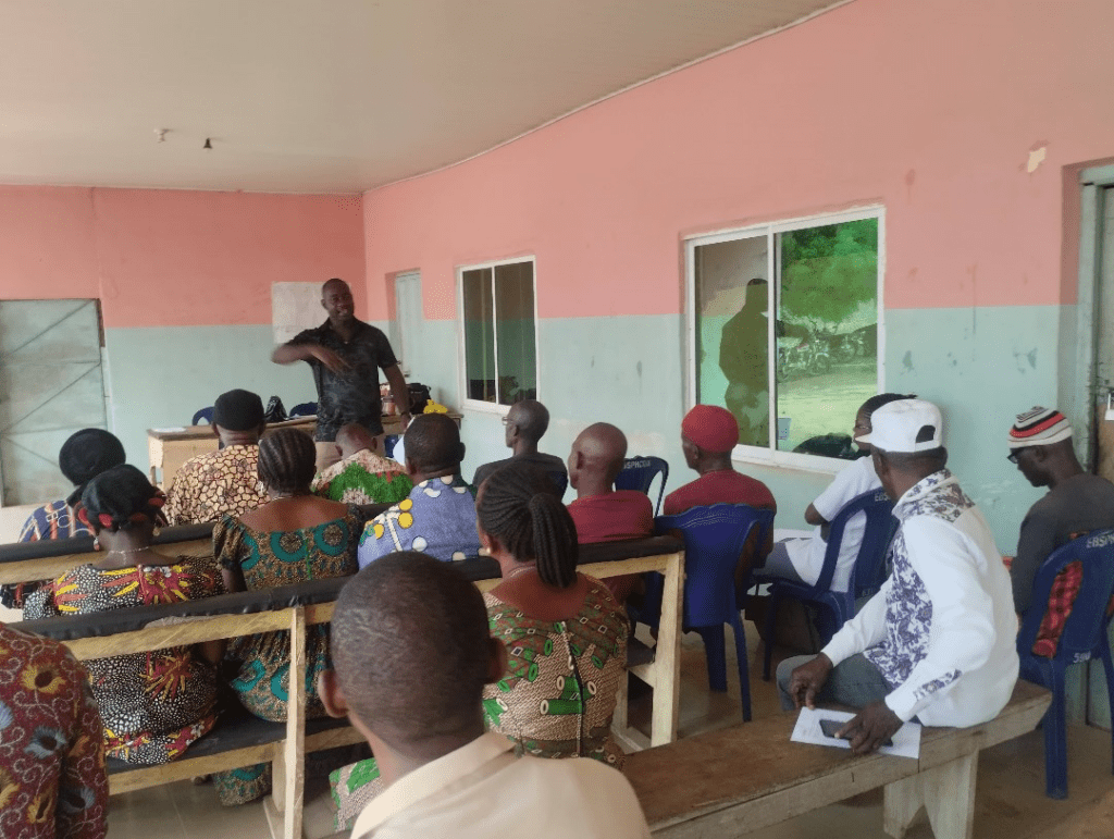 WI-HER GESI Advisor Augustine Onwe discusses the importance of men’s involvement in healthcare delivery during a male engagement in RMNCAH+N meeting in a health center.